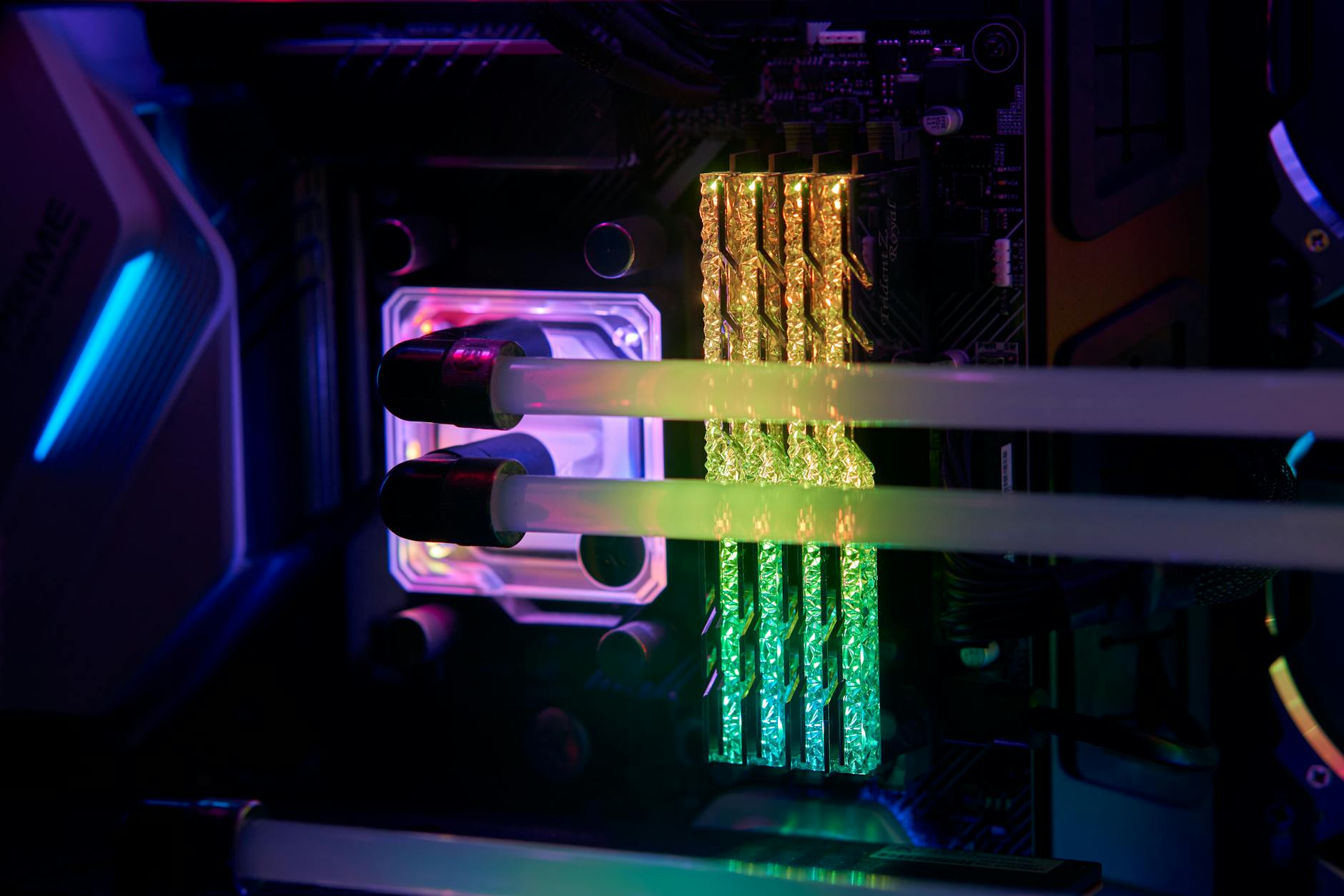 Detailed close-up of illuminated RGB computer hardware with vivid colors.